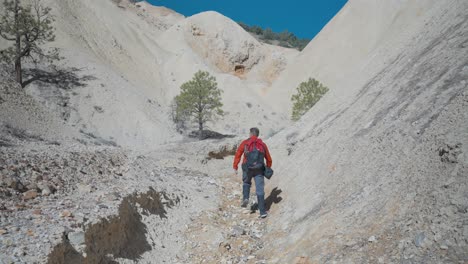Hiker-walking-within-Sulphur-walls-of-Big-Rock-Candy-Mountain