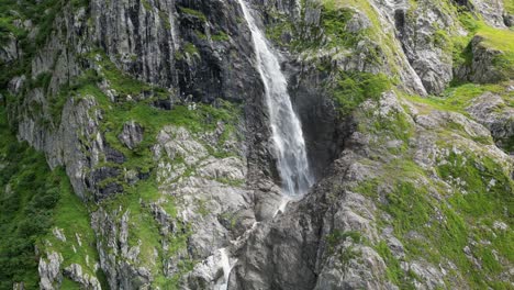 Drone-push-out:-huge-waterfall-in-the-swiss-alps-viewed-by-drone,-aerial-shot,-Obwald,-Engelberg