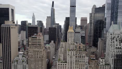 Aerial-view-of-the-6th-Ave-of-the-Americas,-in-cloudy-New-York,-USA---tracking,-drone-shot