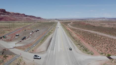 Cars-Traveling-on-Interstate-Highway-Road-in-Deserts-of-Utah-near-Moab,-Aerial