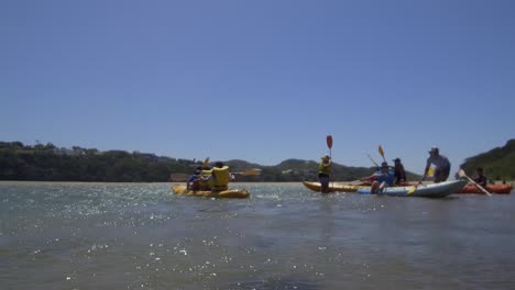 Water-level-angle-of-teens-canoeing-on-Nahoon-River-in-East-London-South-Africa