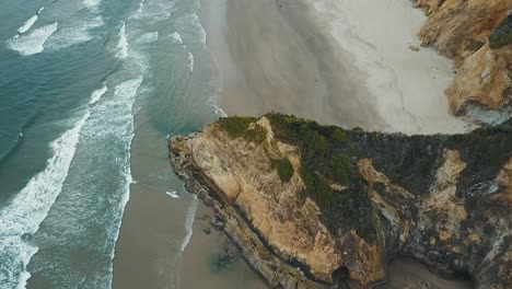 4k-aerial-drone-pan-down-over-rock-outcropping-on-the-Oregon-coast