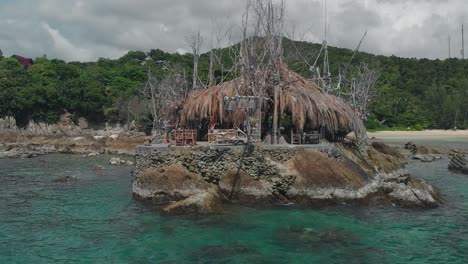 Panoramic-aerial-view-of-Restaurant-on-the-Stony-cliff-Among-the-Coral-bay-on-Tropical-Island