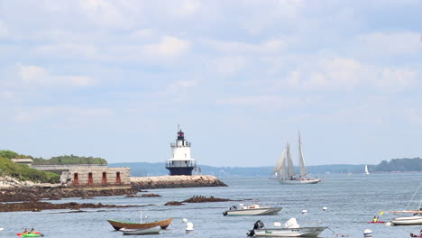 Looking-out-at-sail-boats-and-a-white-lighthouse-at-Willard-Beach