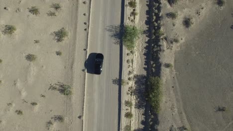 Black-Car-in-Desert-Aerial