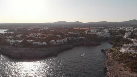 Aerial:-Beautiful-coastline-view-and-town-Cala-D'or-in-Mallorca,-Spain