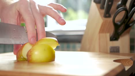 Slow-motion-of-an-apple-being-cut-up-into-bite-sized-pieces