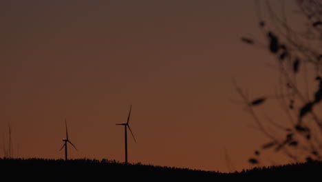 Wind-power-generator-turbine,-at-a-sunny,-evening-dusk,-in-Hoga-Kusten,-Vasternorrland,-Sweden