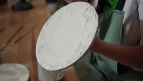 Artist-Carefully-Creating-a-Ceramic-Piece