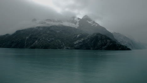A-panning-shot-of-a-misty-Alaskan-glacier-sitting-in-the-calm
