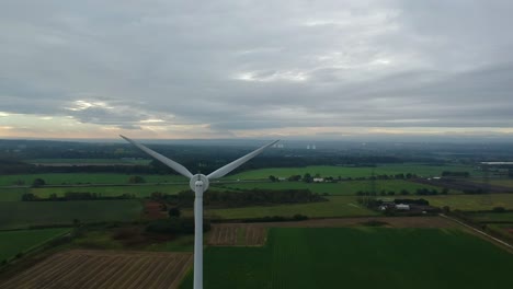 Slow-descending-shot-of-wind-turbine-in-British-countryside