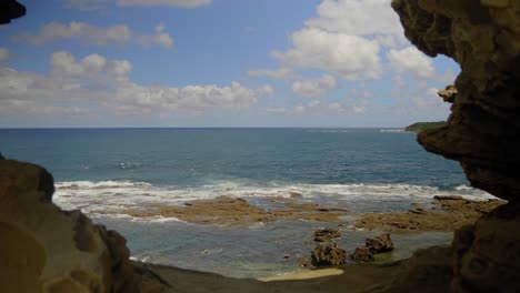looking-through-a-gap-in-the-rock-formations-of-eagles-nest-out-towards-the-ocean-on-Bass-Coast