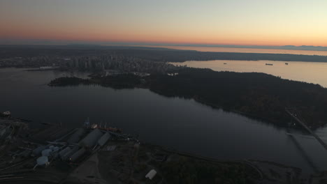 Aerial-wide-shot-of-Downtown-Vancouver-and-Stanley-park-from-North-Shore,-Dusk