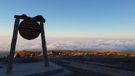 View-From-Horombo-Hut-Sign-at-Sunset-Above-The-Couds-on-Kilimanjaro