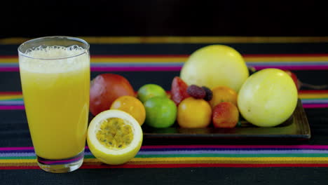 Fresh-fruits-and-a-glass-of-passionfruit-juice