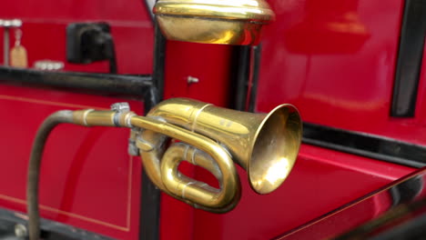 Close-up-shot-of-an-old-lantern-and-a-brass-horn-on-an-oldtimer-bus-coach
