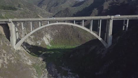 Aerial-Drone-Shot-of-Bixby-Bridge-with-Road-and-Vehicles
