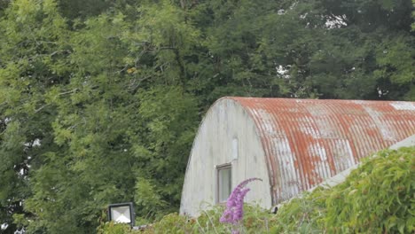 Metal-Farm-Barn-Rounded-Roof-and-Trees