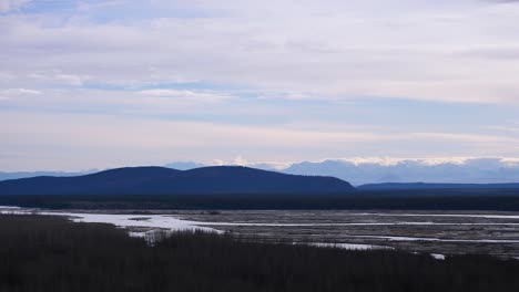 Panning-shot-of-Alaskan-river-and-mountains