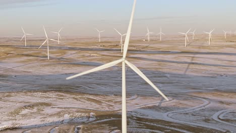 Aerial-shots-of-wind-turbines-on-a-cold-winter-afternoon-in-Calhan,-Colorado