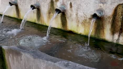 Slowmotion-video-of-La-Jaula-fountain,-Monda,-Malaga,-Spain