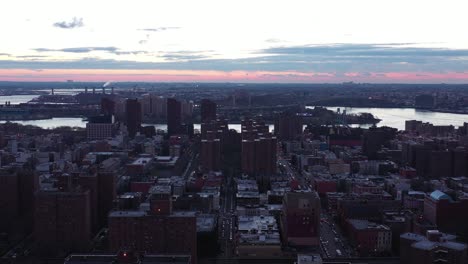 Drone-flyover-New-York-City's-Harlem-neighborhood-at-dawn-daybreak-blue-hour-sunrise