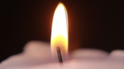 Close-Up-Of-Cutting-Candle-Wick-With-Scissors