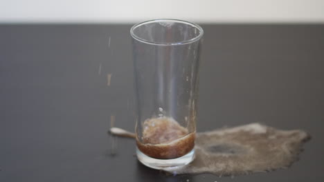 Slow-motion-video-of-a-man-filling-a-glass-with-soda-and-causing-a-spillage