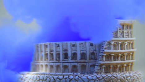 slow-motion-and-close-up-of-colosseum-underwater-with-blue-water-ink-swirling-around-it