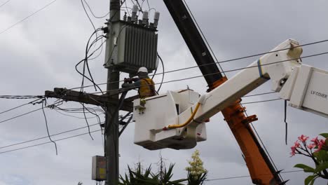 electrical-contractor-works-at-repairing-fallen-power-lines-from-a-recent-storm