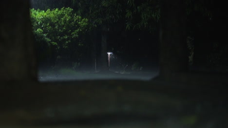 heavy-rain-at-night-with-a-single-street-lamp-in-center