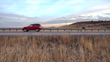 Cars-passing-by-on-a-country-road-in-Colorado