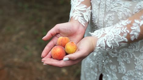Bride-holding-peaches-close-up