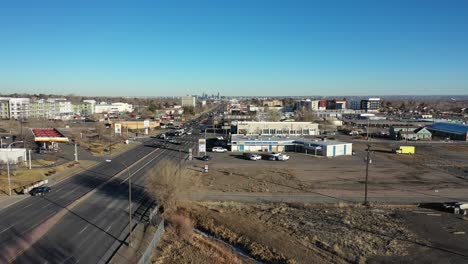 A-rising-shot-above-Colfax-Blvd-as-Denver-Colorado-is-seen-on-the-horizon