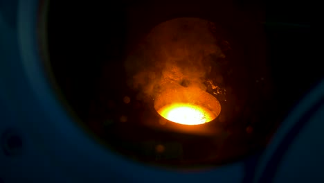 Glowing-hot-fused-metal-in-a-plasma-arc-furnace