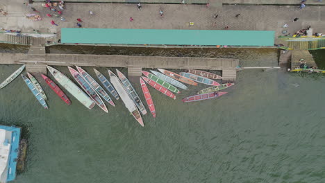 Aerial-shot-of-colorful-boats-on-amazonian-river-margin---Para,-Brazil