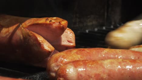 BBQ-Grill-Sausages-Ready-Hot-Smoke-Hand-Turning-over-Close-up-Juicy