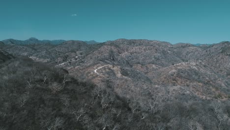 Aerial-shot-of-the-Sierra-of-Sinaloa-with-a-rural-road