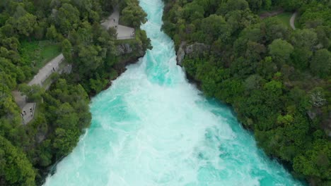 Aerial-drone-shot-rising-above-Hukas-Falls,-New-Zealand