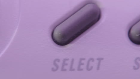 Buttons-on-Vintage-Super-Nintendo-Controller-in-Purple-Light-SLIDE-RIGHT