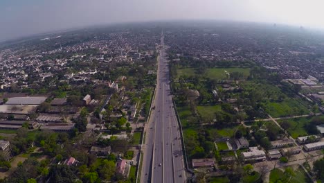 Aerial-over-the-clean-and-green-urban-city`s-highway