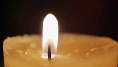 Macro-shot-of-a-candle-dancing-in-the-wind