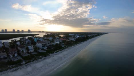Aerial-footage-along-a-south-Florida-beach-during-morning-sunrise