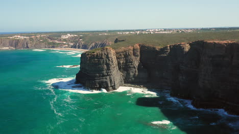 Aerial:-The-cliffs-near-the-town-of-Arrifana-in-Portugal