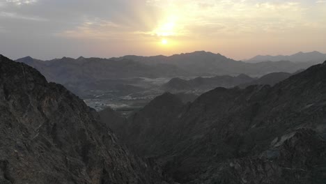 Aerial-view-of-an-amazing-endless-mountain-landscape-sunrise