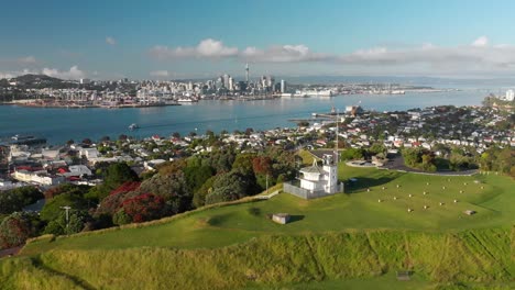 Aerial-shot-of-Mount-Victoria-with-Auckland-skyline-and-Sky-Tower-in-background,-New-Zealand