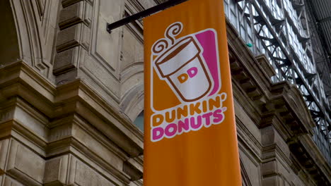 Dunkin-Donuts-flag-or-sign-hanging-outside-the-shop-at-the-Frankfurt-bahnhof