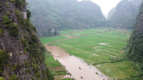 Aerial-shot-over-river-with-row-boats-from-Trang-Ang