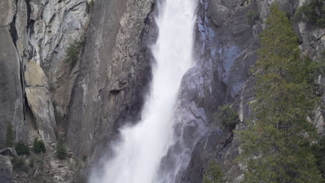 Slow-motion-pan-up-shot-of-lower-Yosemite-falls-in-early-spring
