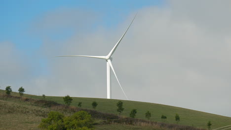Wind-turbine-in-isolation-located-on-a-scenic-hillside